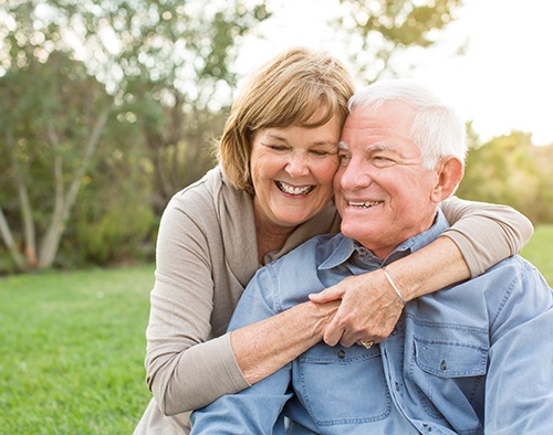 Dentures patient in Morgan Hill smiling with partner