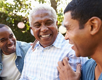 Dentures patient in Morgan Hill talking to family