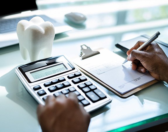 A patient calculating the cost of traditional braces