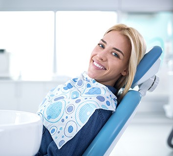 Smiling woman sitting in dental office