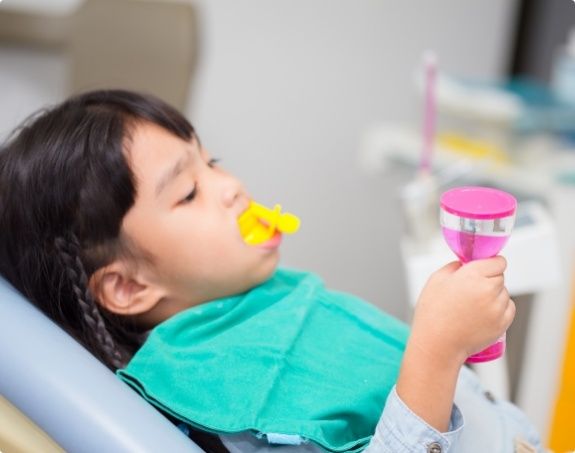 Child receiving fluoride treatment