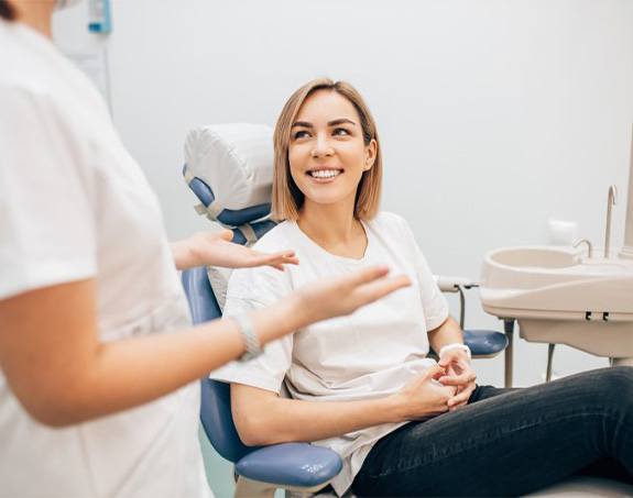 Lady smiles at dentist