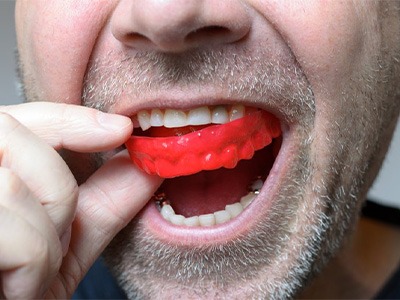 Man wears mouthguard