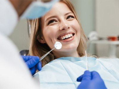 Lady smiles at dentist